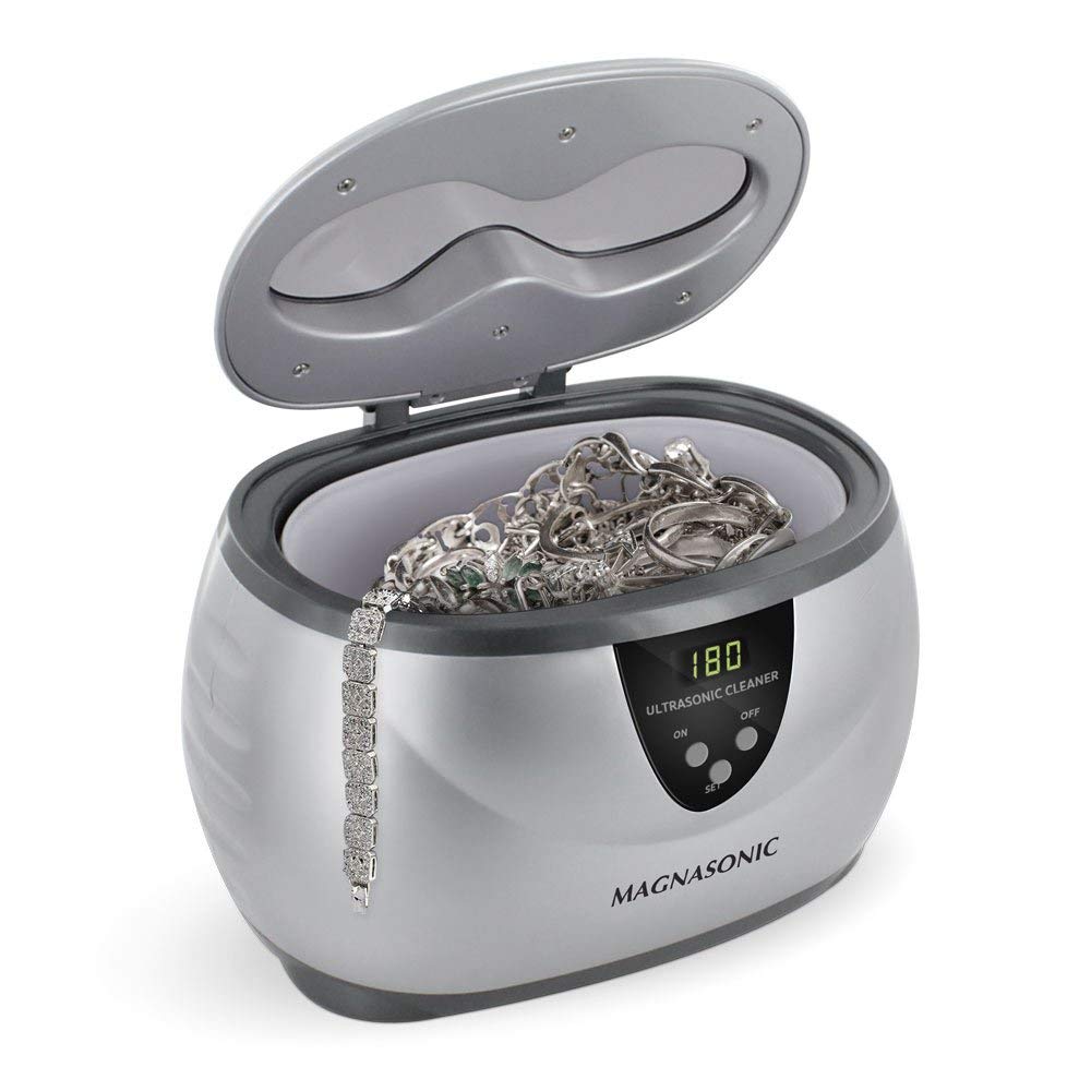 Magnasonic Ultrasonic Jewelry Cleaner with jewelry inside.